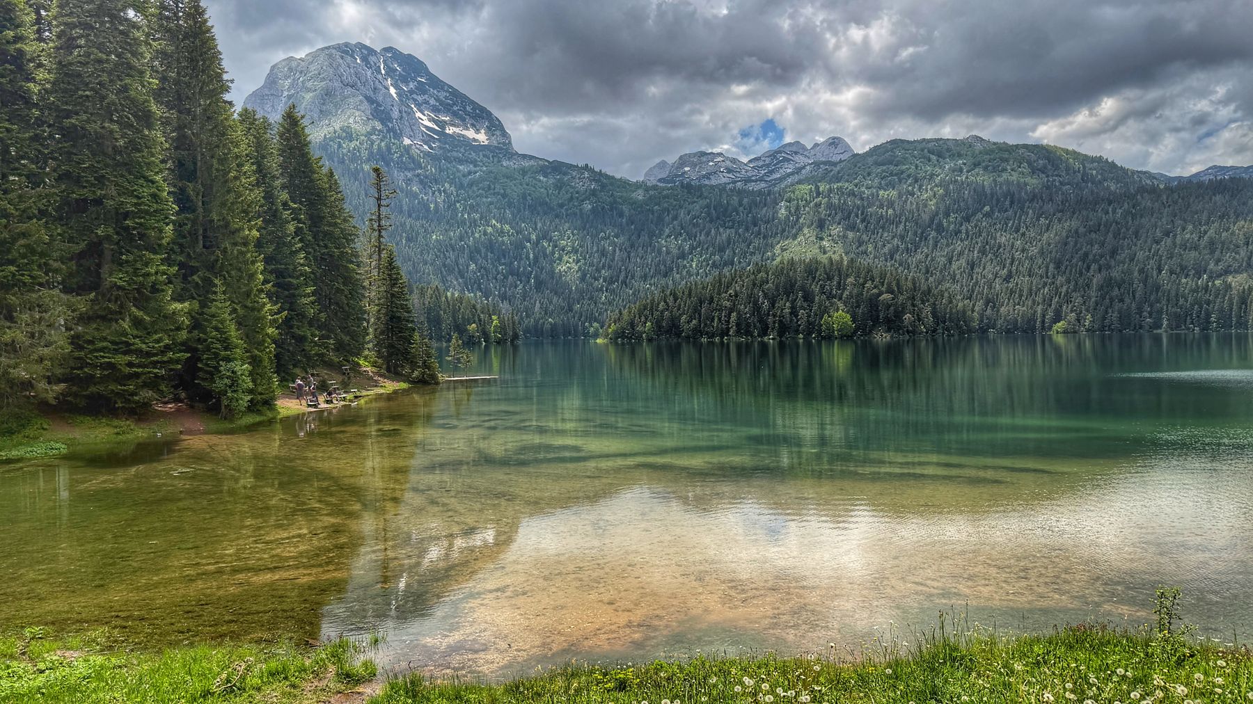 Black Lake (Crno Jezero) ringed by pine forest in Durmitor National Park, Montenegro