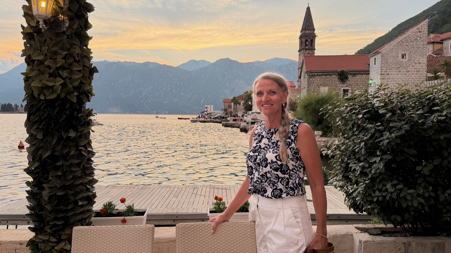 Connie Holton on the Perast waterfront at sunset, Bay of Kotor