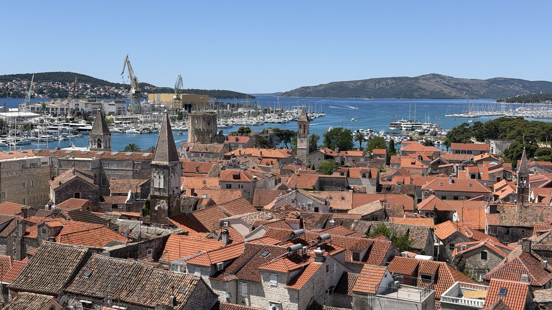 Terracotta rooftops of a Dalmatian old town above the Adriatic Sea