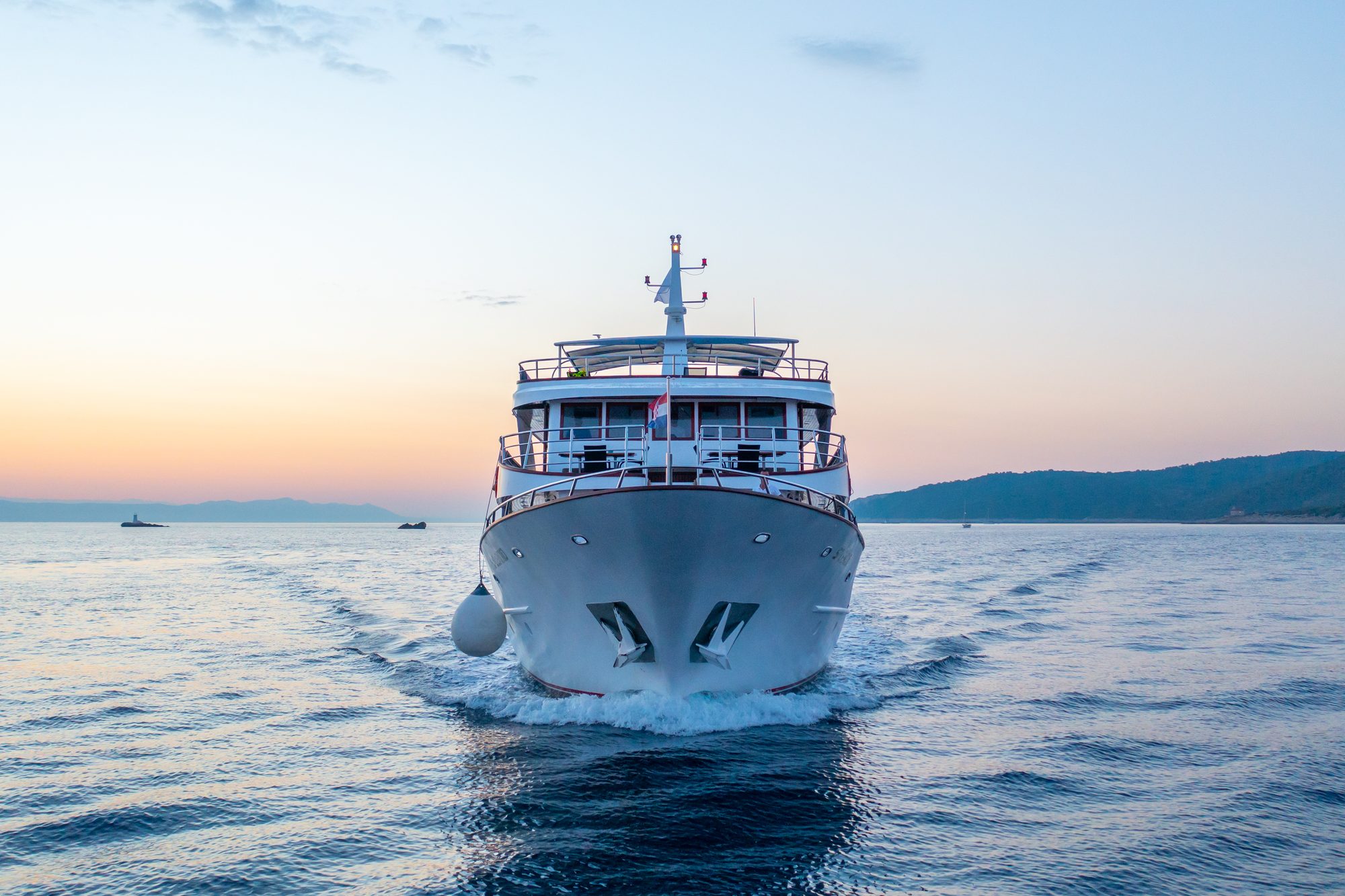 The MS Splendid underway bow-on at first light, her wake trailing behind her