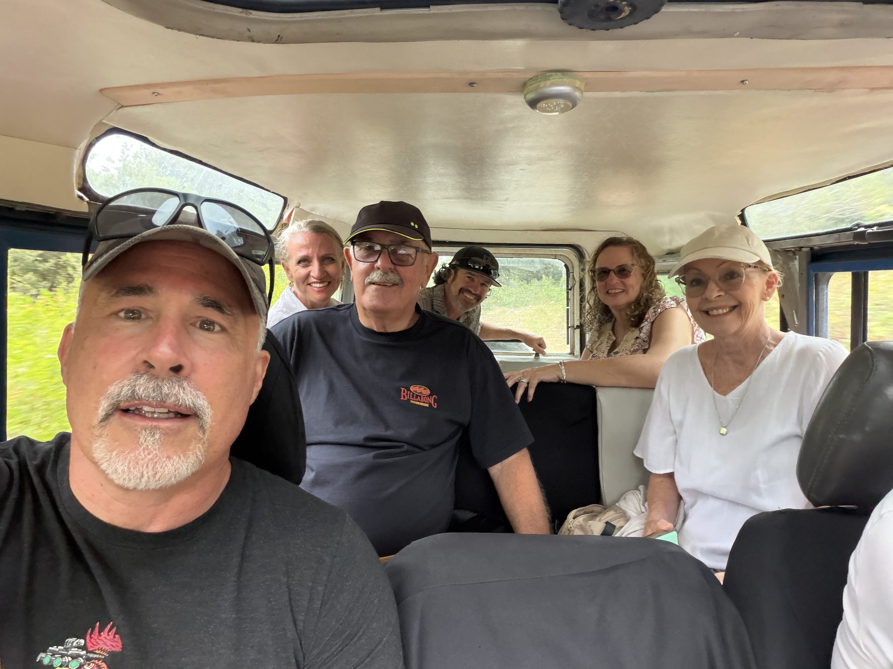 Chuck Holton and fellow travelers riding through the island of Vis in an old military vehicle